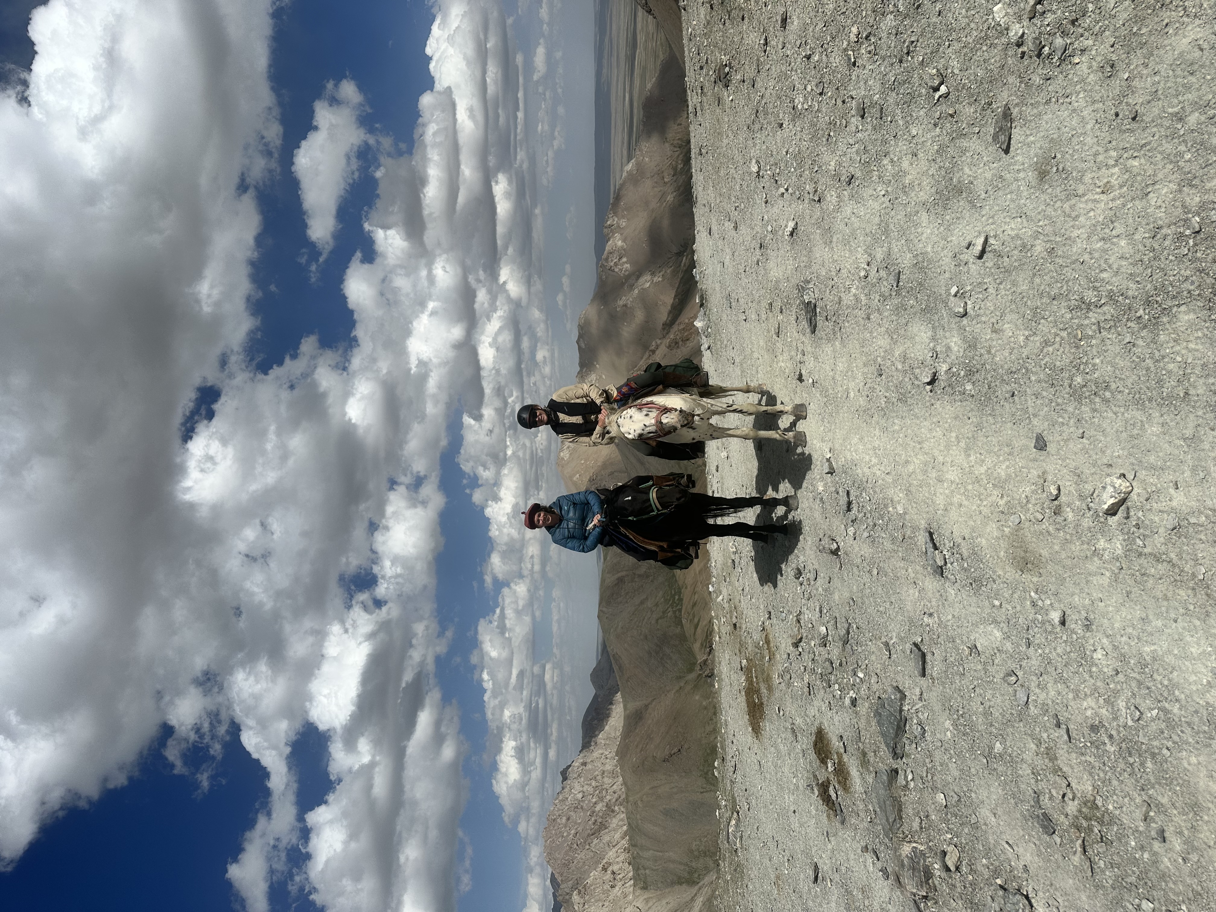 Two riders on mountain pass